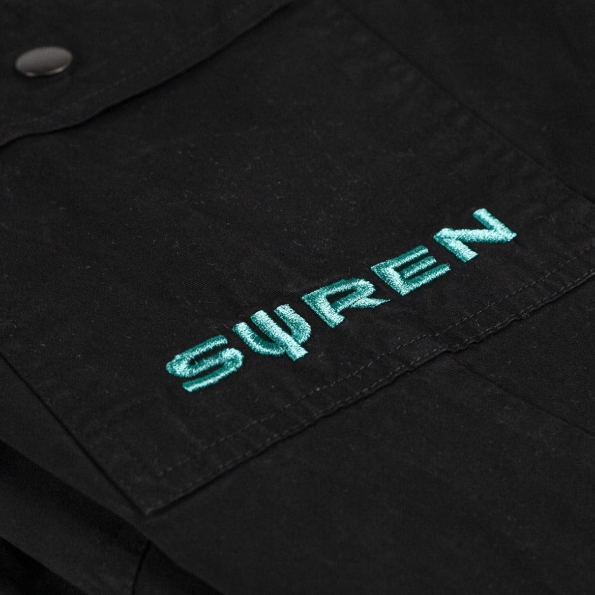 Embroidery on pocket of black coloured Cargo Pants